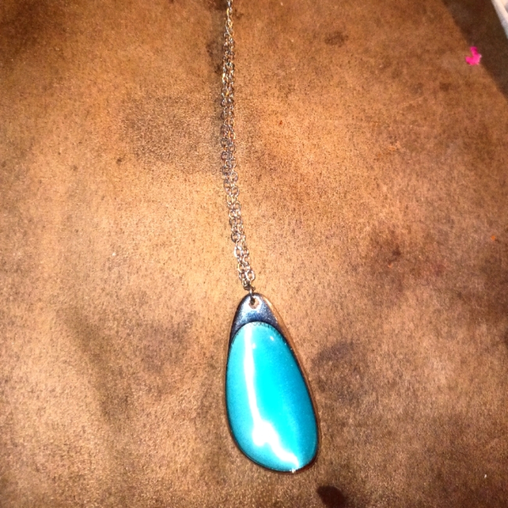 Long necklace. With a blue stone.